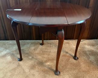 R39 - $65. Round Drop Leaf Side Table. Leaves down it measures 29.5" x 12" x 25" tall. Leaves up 32" x 29.5" x 25" tall.