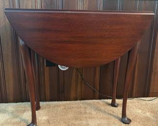 R39 - $65. Round Drop Leaf Side Table. Leaves down it measures 29.5" x 12" x 25" tall. Leaves up 32" x 29.5" x 25" tall.