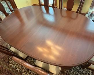 R60 - $600. Knob Creek Dining Table with 2 leaves, 6 chairs & table pad protectors. Excellent condition! Table without leaves is 66" long x 44" wide x 29" tall. 2 - 18" leaves. 2 Captains Chairs. 4 Regular Chairs. All sturdy and solid.