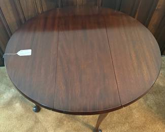 R39 - $65. Round Drop Leaf Side Table. Leaves down it measures 29.5" x 12" x 25" tall. Leaves up 32" x 29.5" x 25" tall.