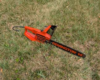 R97 - $40. Remington 14" 2HP Electric Chainsaw.