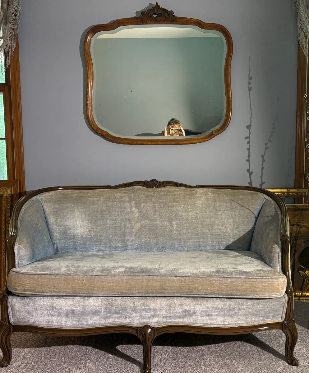 Furniture City, Grand Rapids Mid Century Settee in Ice Blue Velvet, Mint, with French country beveled and carved mirror. Carved