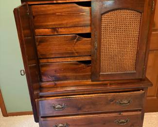 Dark wood Young Hindle Chifforobe with cane doors and multiple interior drawers and matching nightstand