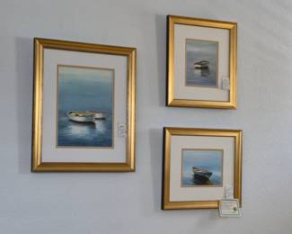 Set of three various skiffs in water