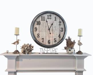 Mantel with large clock, seabird and shell decor