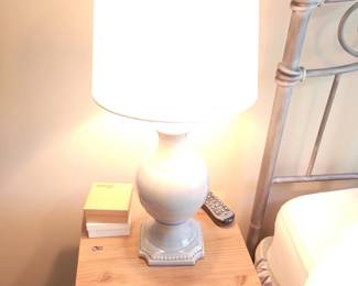 Table lamp with white ceramic Urnshaped base and fabric drum shade