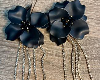 Large black floral earring with dangling rhinestones