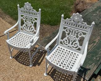 Pair of Iron Chairs by pool