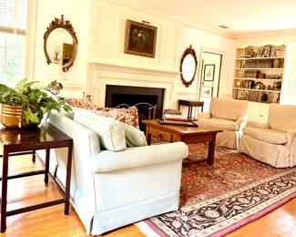Custom covered chairs , antique coffee table and a rug to die for!