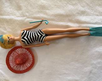 Original Barbie Doll in classic striped swimsuit