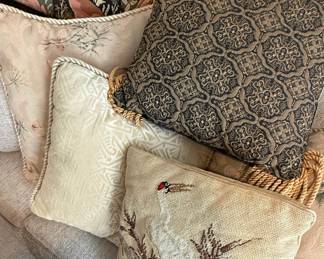 Assorted Decorative Pillows with Paisley and Wildlife Motifs