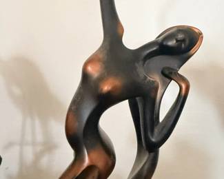 Bronze nude sculpture.
