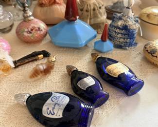 Pair of cobalt fish-shaped dishes or trays and surrounding small pottery.