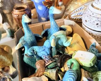 Small turquoise and blue bird/animal figurine lot with shell and pottery pieces.