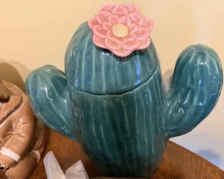Vintage green ceramic cactus cookie jar or covered container with pink flower.