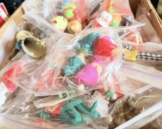 Bagged toy/holiday smalls with colorful balls, miniature pieces and craft items.