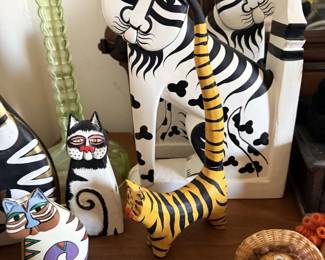 Laurel Burch-style colorful cat wall art and cat figurines.