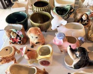Animal planters, figural vases and small pottery bowls and mugs.