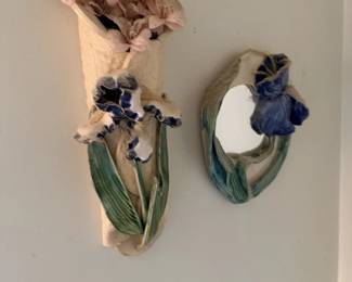 Pair of ceramic floral wall pockets or sconce-style wall decor with pink and blue flowers.