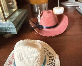 Hat lot including straw hats, pink hat and novelty or embroidered pieces.