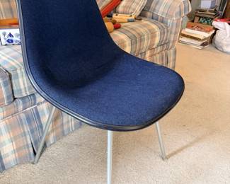 Eames-style blue molded shell side chair with chrome legs, mid-century modern look.
