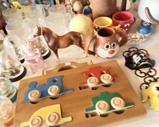Small wooden tea set, painted plates, miniature cups and novelty kitchen collectibles.