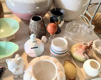 White pottery planters, crocks and ceramic containers grouped together.