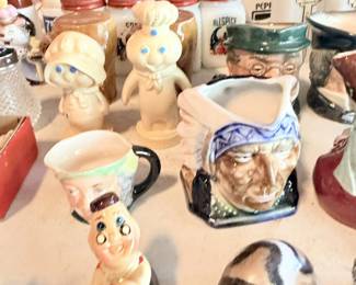 Figural salt-and-pepper shakers and character pottery, including chef, masks and novelty pieces.