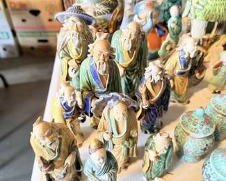 Chinese mudman-style elder/wise men figurine group; colorful glazed figures.