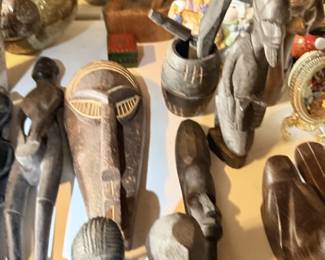 Carved wood and elephant/animal figurine grouping, including gray elephant figures.