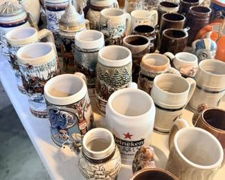 Large beer stein and stoneware mug collection; German-style ceramic steins.