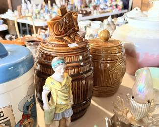 Brown ceramic canister set, chrome/silver pieces, figurines and mixed tabletop decor.