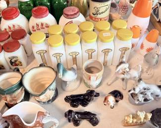 Kitchen smalls: spice jars, yellow-lid containers, egg cups, bells, bowls and tiny pottery.