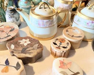 Limoges-style painted trinket boxes and egg-shaped covered containers.