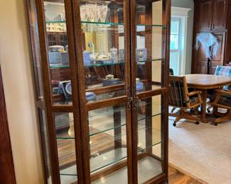 Beautiful, large, lighted glass curio cabinet. Lights up at top AND bottom to showcase! Cabinet is 51" x 16" x 77". I have a great local mover I can recommend if needed!