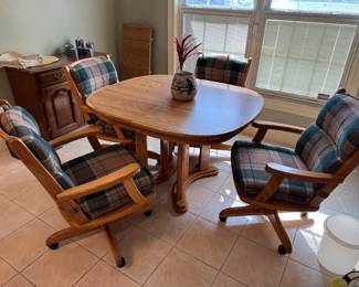 These sets are the best! So comfortable, can sit and chat for hours. also so hard to damage/show wear with time! Laminate top. Comes with 1 additional leaf.