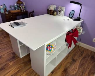 Awesome large crafting table with open cubbies. Craft table is 73" x 48" x 34"