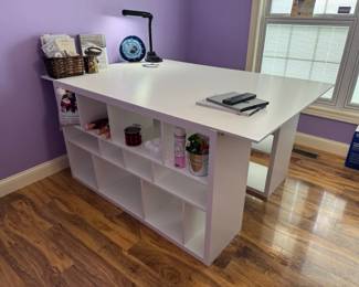 Awesome large crafting table with open cubbies. Craft table is 73" x 48" x 34"