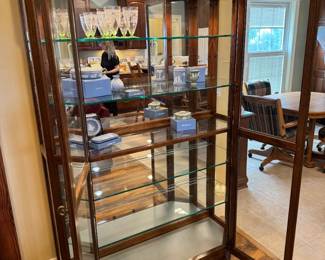 Beautiful, large, lighted glass curio cabinet. Lights up at top AND bottom to showcase! Cabinet is 51" x 16" x 77". I have a great local mover I can recommend if needed!