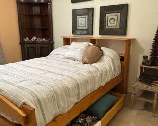 Full-size custom wood bed with rolling storage tray