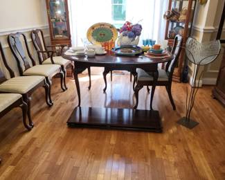Cherry dining table , two leaves, 6 chairs and handmade glass art piece for floral arrangments
