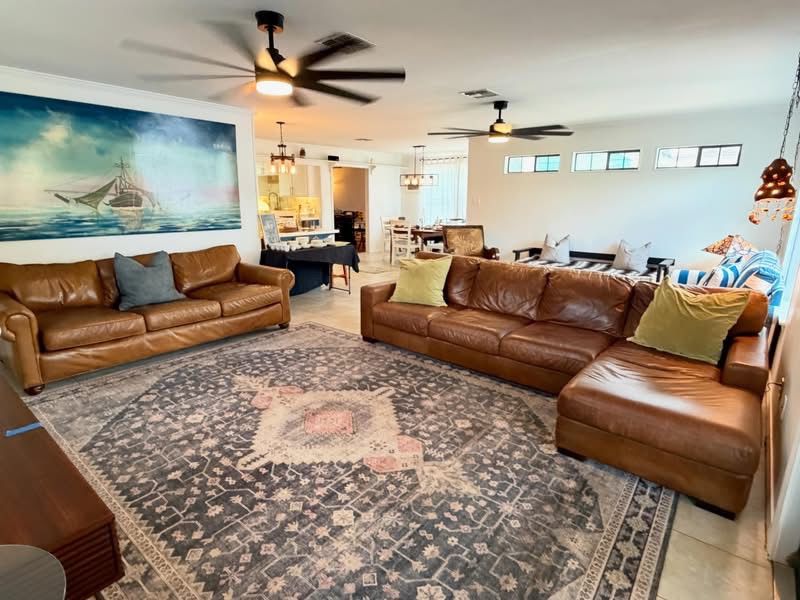 leather sectional and leather sofa, large oil painting