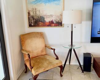 vintage arm chair, glass top lamp table, modernist oil painting
