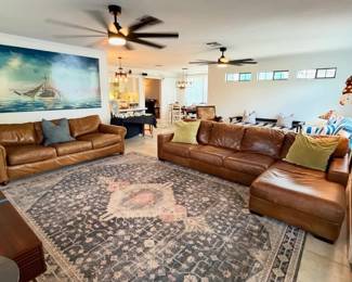 leather sectional and leather sofa, large oil painting