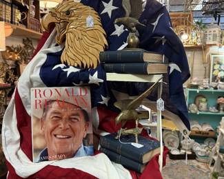 wooden carved eagle, Ronald Reagan coffee table book, brass, china