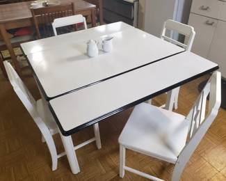 Sellers porcelain enamel top farm table (shown with stowable leaves extended). Includes the four white chairs.