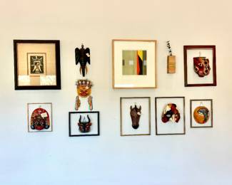 Gallery wall of masks from around the world.