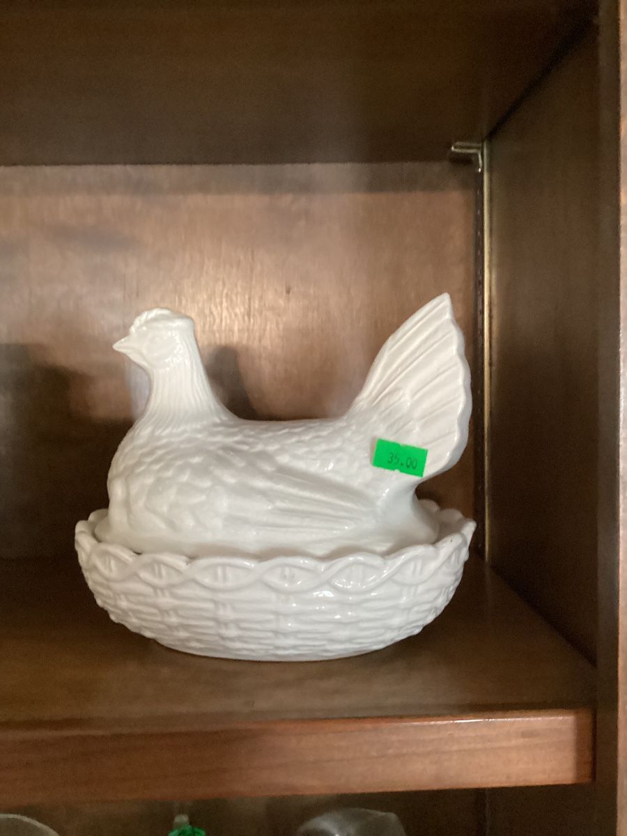 Ceramic hen on nest. Bottom is marked England.