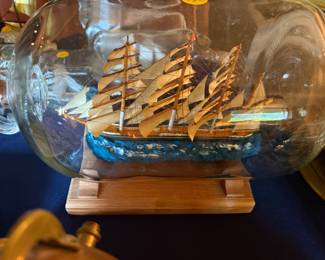 One of a collection of ships in a bottle