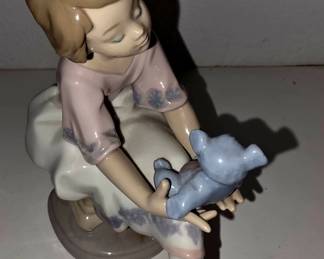 This is Lladró “Best Friend” #7620, girl sitting with a blue teddy bear. It was a 1993 Collectors Society piece and retired shortly after; examples are commonly identified as #7620.